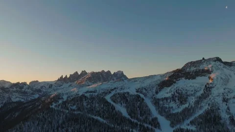 Sunset over the snow-capped Dolomites in the Italian Alps Stock Footage 233977368
