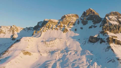Sunset over the snow-capped Dolomites in the Italian Alps Stock Footage 233978214