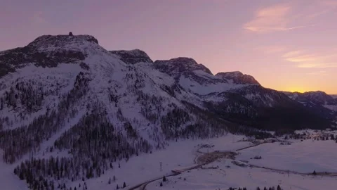 Sunset over the snow-capped Dolomites in the Italian Alps Stock Footage 233978323