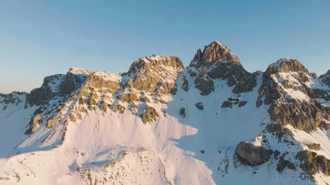Sunset over the snow-capped Dolomites in the Italian Alps Stock Footage 233978618