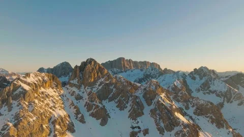 Sunset over the snow-capped Dolomites in the Italian Alps Stock Footage 233979000