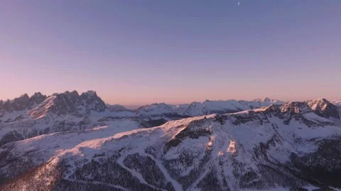 Sunset over the snow-capped Dolomites in the Italian Alps Stock Footage 233979723