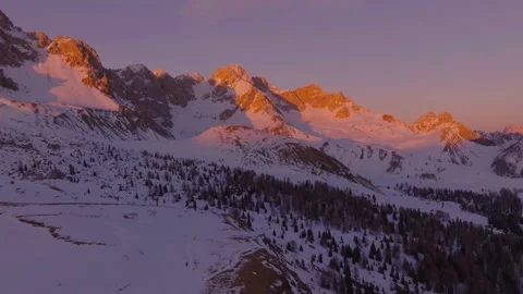 Sunset over the snow-capped Dolomites in the Italian Alps Stock Footage 233980482