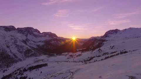 Sunset over the snow-capped Dolomites in the Italian Alps Stock Footage 233983074