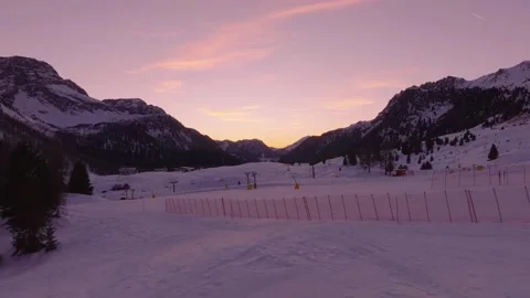 Sunset over the snow-capped Dolomites in the Italian Alps Stock Footage 233985198