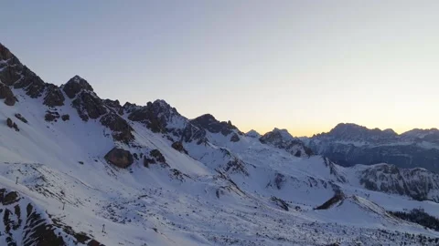 Sunset over the snow-capped Dolomites in the Italian Alps Stock Footage 233988165