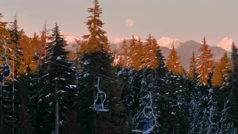 Sunset Over Snow-Covered Forest and Mountains with Ski Lift Vídeos de archivo 301714711