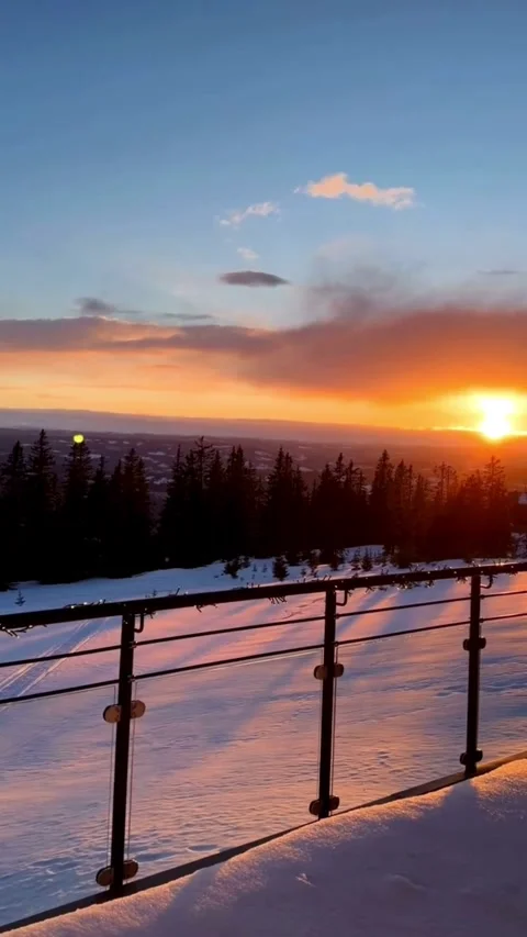 Sunset Over Snow-Covered Landscape from a Balcony Vidéo 332049007