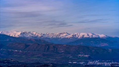 Sunset over snowy mountains Stock Footage 123985797