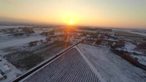 Sunset over snowy town Stock Footage 47522599