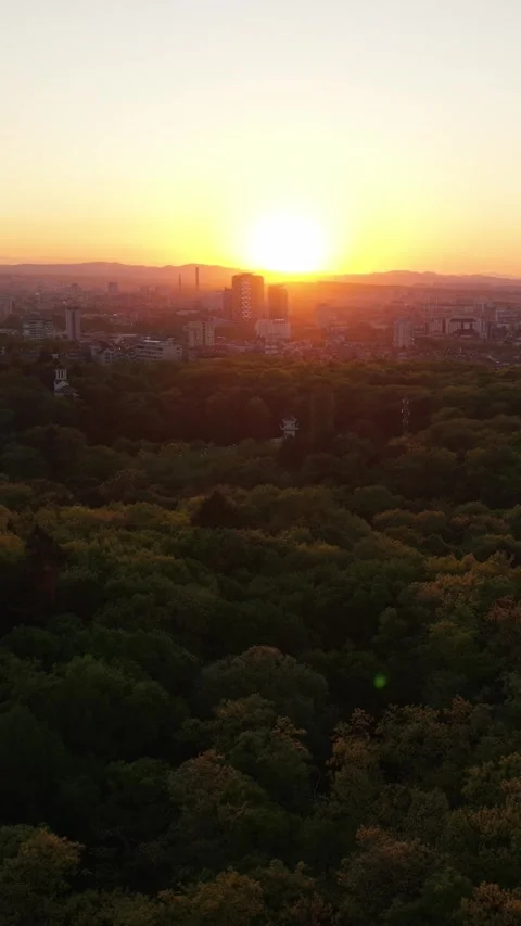 Sunset Over Sofia: Aerial Cityscape with Golden Light and Scenic Views Video stock 336088308