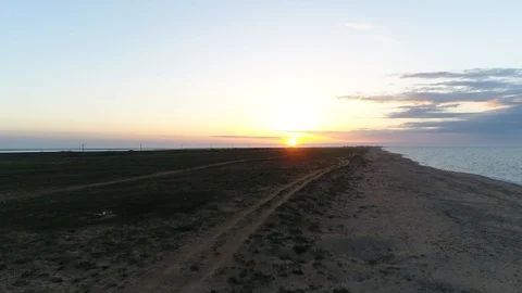 Sunset over the Spit Between the Sea of Azov And lake Sivash. Air View. Russia. Stock Footage 126275802