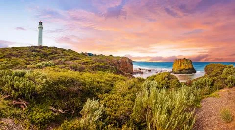 Sunset over Split Point Lighthouse and Eagle rock on Great Ocean Road in Aust Stock Photos