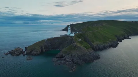 Sunset over Start Point Lighthouse, Trinity House and South West Coast Path, UK Stock-Footage 246599903
