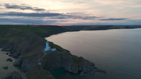 Sunset over Start Point Lighthouse, Trinity House and South West Coast Path, UK 스톡 동영상 246600950