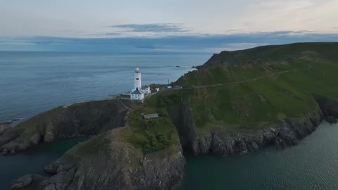 Sunset over Start Point Lighthouse from a drone, Trinity House, Devon, England 動画素材 261042729
