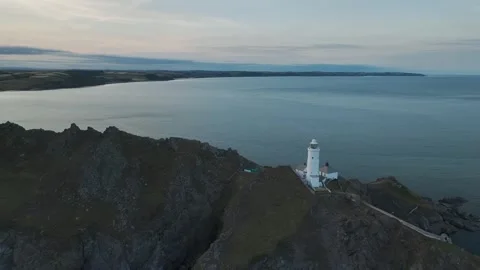 Sunset over Start Point Lighthouse from a drone, Trinity House, Devon, England 動画素材 261042762