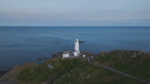 Sunset over Start Point Lighthouse from a drone, Trinity House, Devon, England 動画素材 261042794