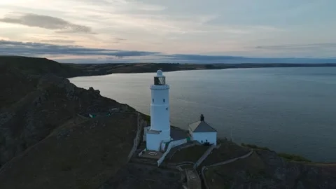 Sunset over Start Point Lighthouse from a drone, Trinity House, Devon, England 動画素材 261042828
