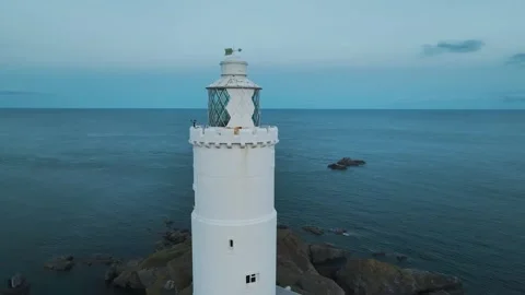 Sunset over Start Point Lighthouse from a drone, Trinity House, Devon, England 動画素材 261042974