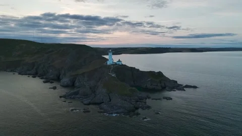 Sunset over Start Point Lighthouse from a drone, Trinity House, Devon, England 動画素材 261043057