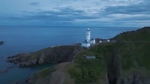 Sunset over Start Point Lighthouse from a drone, Trinity House, Devon, England 動画素材 261043111