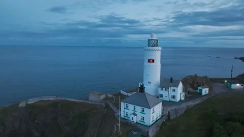 Sunset over Start Point Lighthouse from a drone, Trinity House, Devon, England 動画素材 261043170