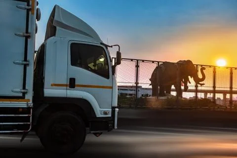 Sunset over a statue of the holy three-headed elephant, Samut Prakan Stock Photos