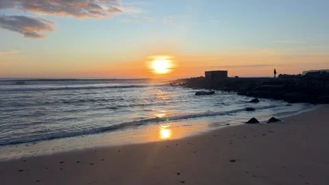 Sunset Over Stone Breakwater in Barbate Stock Footage 330983722