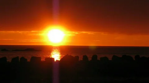 Sunset over stone jetty Stock Footage 368947