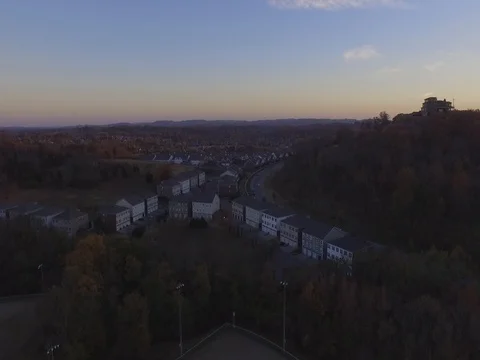 Sunset Over Suburbia in Fall Aerial Drone Slow Rise Shot in 2K Stock Footage 74718232