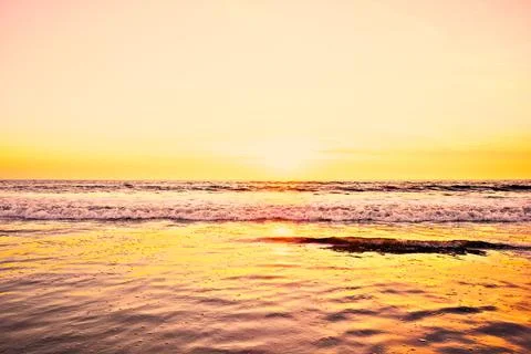 Sunset over the surf. Stock Photos