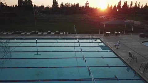 Sunset over swimming pool Stock Footage 132018219