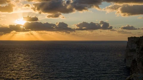 Sunset over te cenc cliffs Malta Gozo island time lapse 4 k 60 fps Stock Footage 119839280