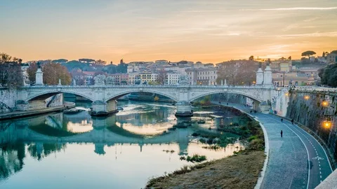 Sunset over the Tiber river in Rome in the winter, zoom in Stock Footage 99634103