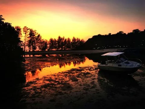 Sunset over tidal beachfront Stock Photos