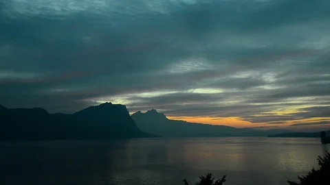 Sunset over the tops of the mountains. Alps in central Switzerland. Lake Lu Stock Footage 108906502