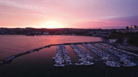 Sunset over Torquay Marina from a drone, English Riviera, Torbay, Devon, England 動画素材 207403405