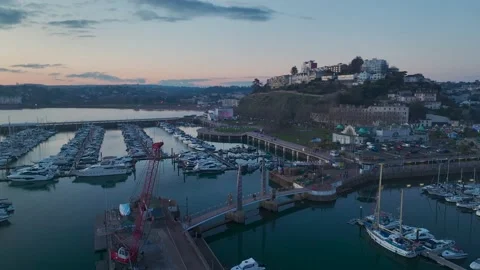Sunset over Torquay Marina from a drone, English Riviera, Torbay, Devon, England 動画素材 229557600