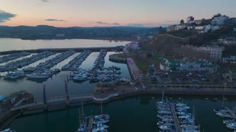 Sunset over Torquay Marina from a drone, English Riviera, Torbay, Devon, England 動画素材 229558332