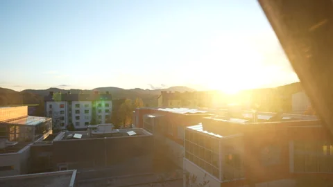 Sunset over town buildings Stock Footage 320607171