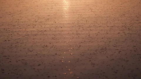 Sunset over a tranquil lake with golden reflections on the calm water surface 스톡 동영상 299729557