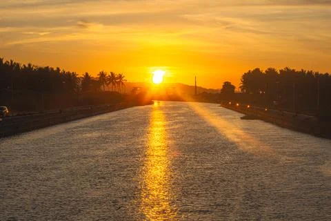Sunset Over a Tranquil River Stock Photos