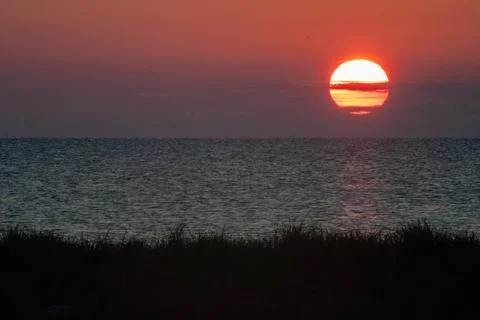 Sunset over tranquil waters Stock Photos