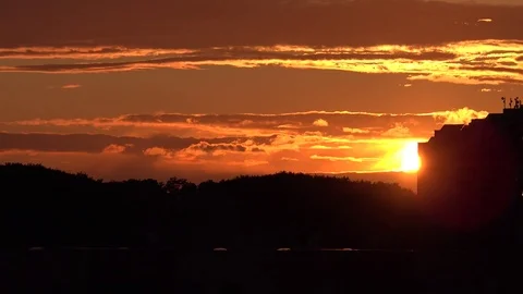 Sunset over trees and building 스톡 동영상 80249265