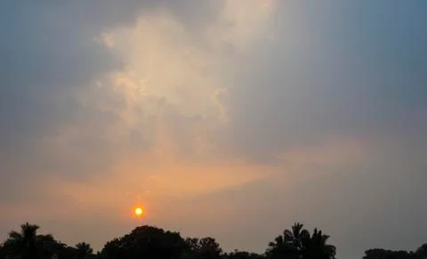 Sunset over the trees Stock Photos