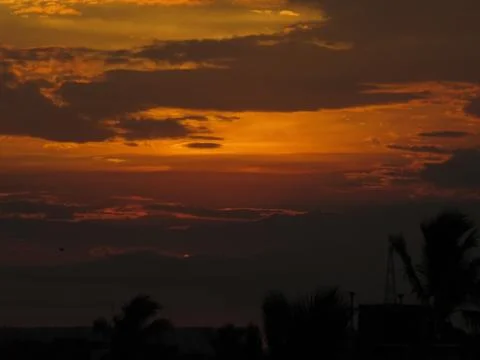 Sunset over the trees Stock Photos