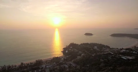 Sunset Over Tropical Beaches in Phuket Thailand Aerial Pan Shot Stock Footage 65021772