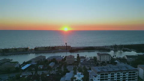 Sunset over Turtle Beach from Little Sarasota Bay Flyover Stock Footage 303187675