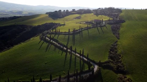 Sunset over Tuscan Hillside with Cypress Trees 스톡 동영상 242618760